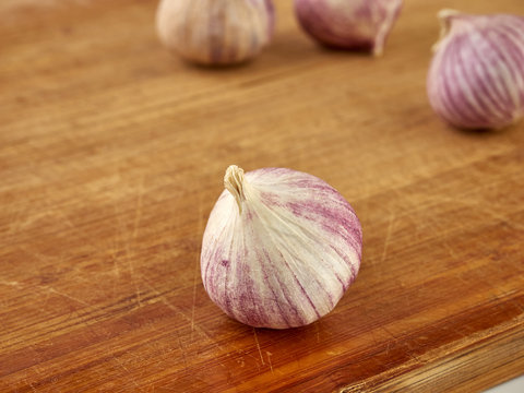 Fresh garlic on market table closeup photo