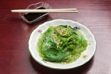 Japanese sushi plate, on wooden background.