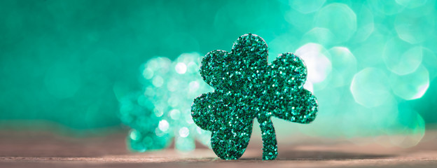 St Patrick's day background with shamrock clover leaf, Irish festival symbol, selective focus,...
