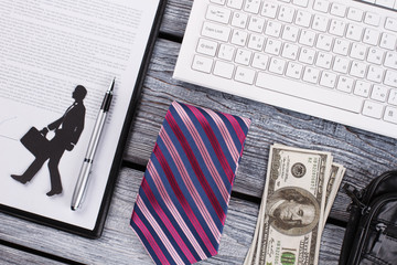 Money, tie and wallet. Successful businessman flatlay. Quality men's stuff on background.