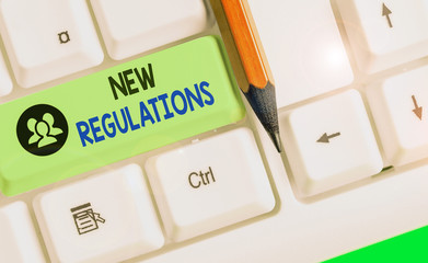 Conceptual hand writing showing New Regulations. Concept meaning rules made by a government or...