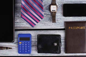 Passport, mobile phone and watch. Office man composition. Business concept.
