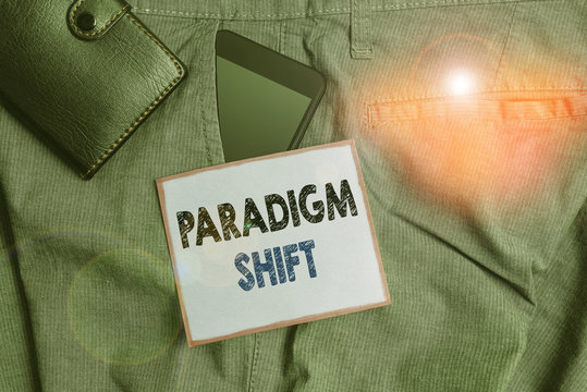 Handwriting text Paradigm Shift. Conceptual photo fundamental change in approach or underlying assumptions Smartphone device inside trousers front pocket with wallet and note paper