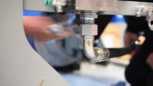  worker who assembles hydraulic components on very high pressure hydraulic system