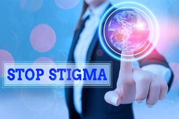 Writing note showing Stop Stigma. Business concept for end the feeling of disapproval that most...