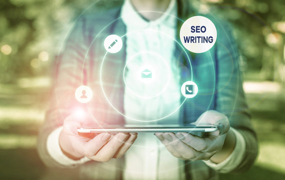 Writing note showing Seo Writing. Business concept for grabbing the attention of the search engines using specific word