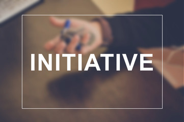 Initiative word with business blurring background