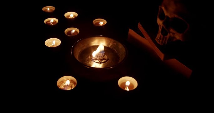 Burning pentacle on altar closeup footage