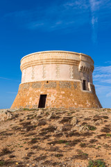 Fototapeta na wymiar Torre de Fornells, coastal defense tower to guard the entrance to Fornells harbour. Menorca, Spain