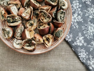 Moldy chestnuts on a white plate. Selective focus.