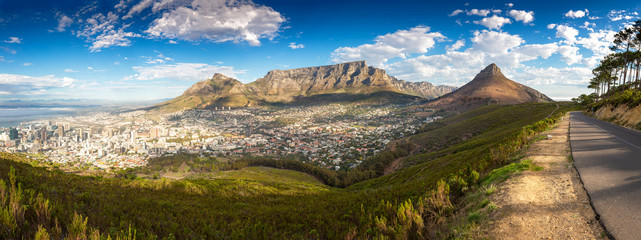 Panoramic landscape with sunset over Cape Town with Lions Head and Table Mountain in the background, taken from Signal Hill  (high resolution)