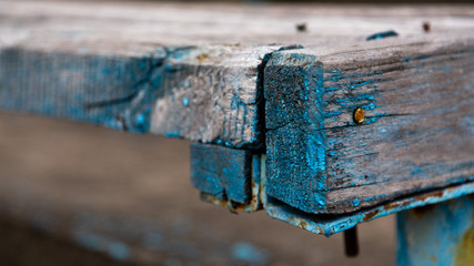 Close-up picture of an old wooden bench. Copy-space for writing