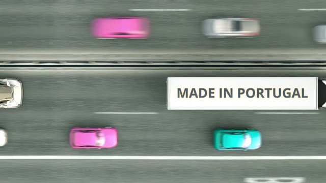 Aerial overhead view of trailer trucks with MADE IN PORTUGAL text driving along the road. Portuguese business related loopable 3D animation