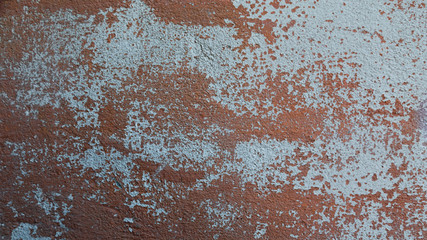 Rusty metal wall, old sheet of iron covered with rust with multi-colored paint background texture
