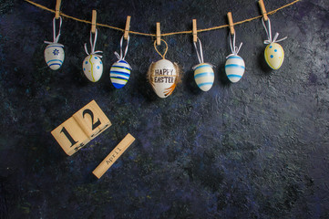Easter holiday card concept with eggs on blue background with copy space