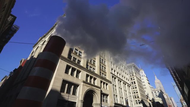 Steam rises and drifts among the rows of the Fifth Avenue buildings in the wintertime at Midtown Manhattan New York City NY USA on Dec. 27 2018.