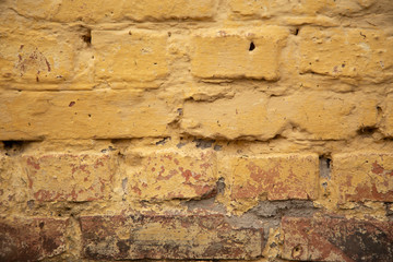 old yellow brick wall texture background close up. free space for text. wallpaper for your device