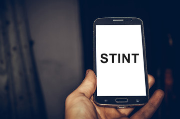 Stint word written in smartphone