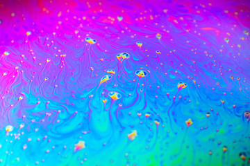Macro photo of a rainbow soap bubble