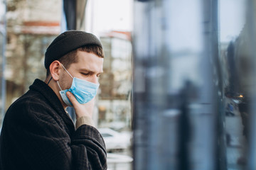 Man in the street wearing protective masks.