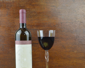 bottle of wine and glass stand on brown wooden background