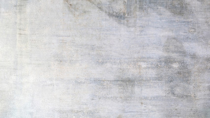 Texture of a old grungy gray concrete wall with cracks as a background or wallpaper
