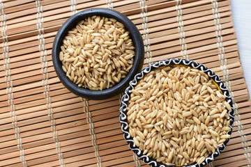 Natural oat grains, in containers for display