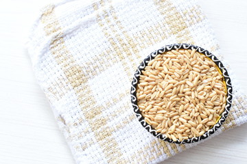 Natural oat grains, in containers for display