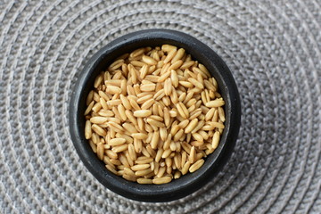Natural oat grains, in containers for display