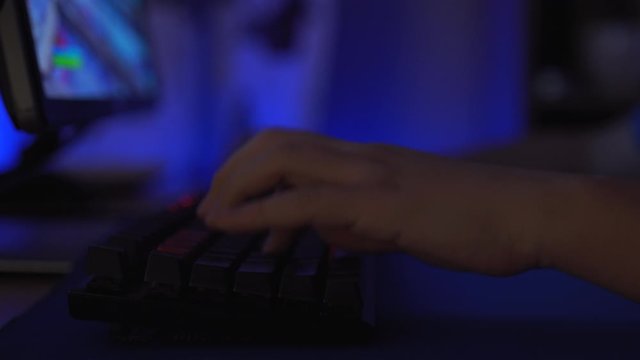 Game Using Keyboard. Male Hacker Breaks into System.