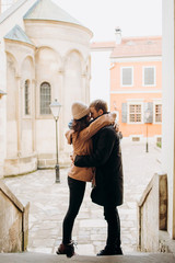Fototapeta premium Beautiful couple walking through the street of the ancient city