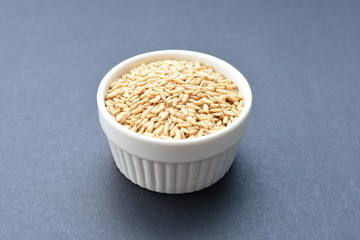 Natural oat grains, in containers for display