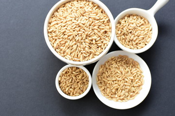 Natural oat grains, in containers for display