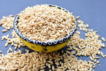 Natural oat grains, in containers for display