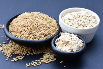 Oat grains and flakes, in containers for display