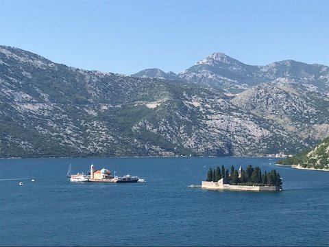 Our Lady of the Rocks and Island of St. George,  two islet landmarks on Kotor Bay in Perast, Montenegro
