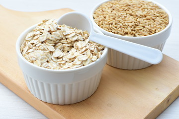 Oat grains and flakes, in containers for display