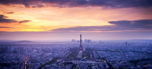 panorama of skyline of Paris with Eiffel Tower at sunset in Paris, France. Eiffel Tower is one of the most iconic landmarks of Paris.