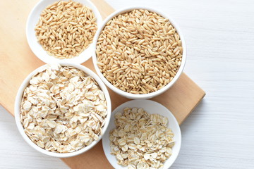 Oat grains and flakes in containers for display