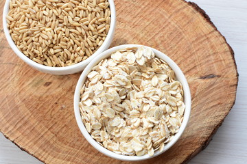 Oat grains and flakes in containers for display
