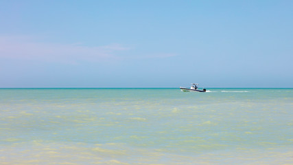 Fototapeta na wymiar Calm ocean with boat, Florida, USA