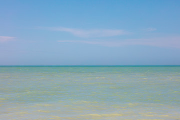Fototapeta na wymiar Calm ocean with horizion and blue sky, Florida, USA