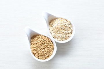 Oat grains and flakes in containers for display