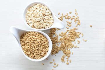 Oat grains and flakes in containers for display