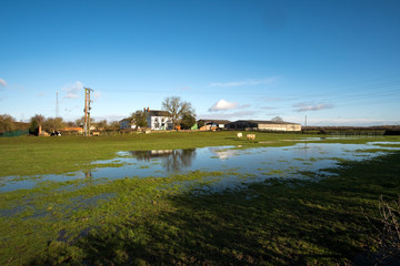 Farm with flood water on fields