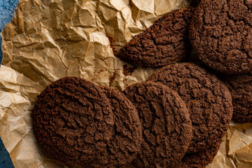 Chocolate chip cookies on dark old wooden table with place for text., freshly baked. Selective Focus with Copy space.