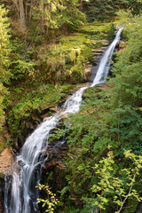 Blurred water of waterfall of Kamienczyk river in Poland