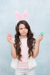 not enaugh eggs. sad girl with rabbit ears and eggs. small daughter collect painted eggs. easter egg hunt. spring easter holiday. ready for spring and holiday. Girl hunts for eggs. Happy easter