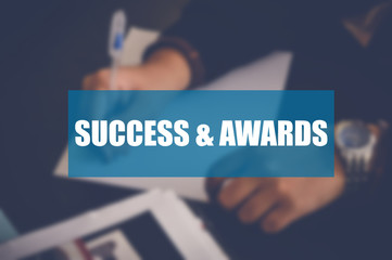 Success awards word with blurring business background