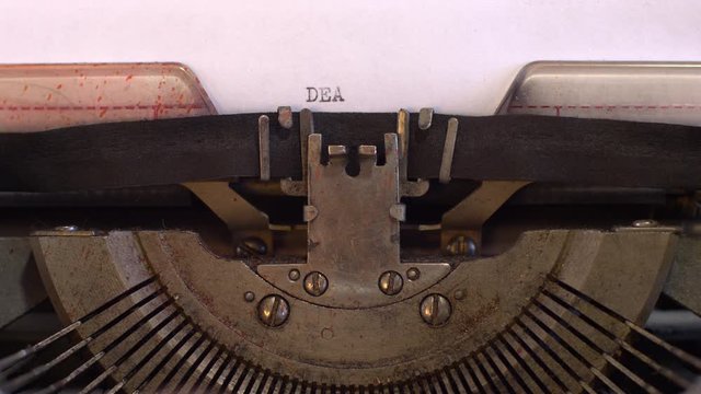close-up typing a text DEAR MR PRESIDENT, old vintage typewriter with a sheet of paper 